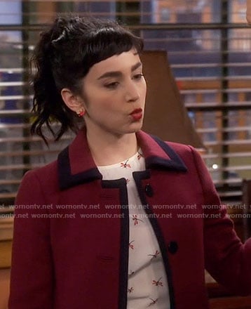 Mandy’s dragonfly print top and red coat with navy trim on Last Man Standing