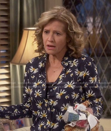 Vanessa’s black daisy print shirt on Last Man Standing