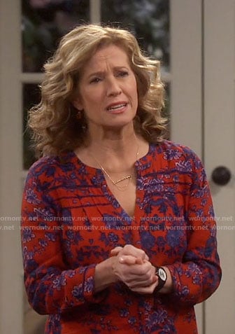 Vanessa’s red floral split-neck top on Last Man Standing