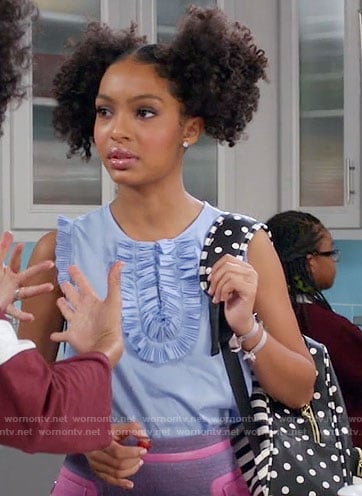 Zoey’s blue ruffled top, purple and pink skirt and polka dot backpack on Black-ish