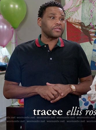 Andre’s black polo shirt with red and green collar on Black-ish