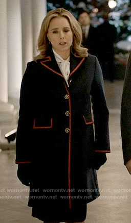 Elizabeth’s navy coat with red trim on Madam Secretary
