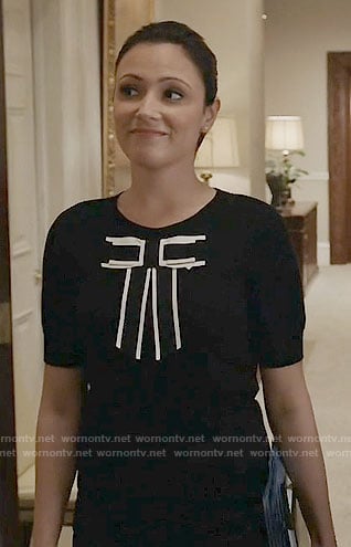 Emily’s black top with white trimmed bow on Designated Survivor