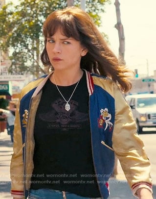 Sophia’s blue and yellow embroidered bomber jacket with Japan map on the back on Girlboss