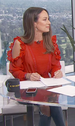 Catt’s red ruffled cold-shoulder top on E! News