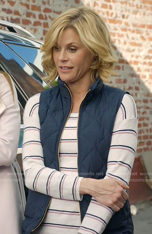 Claire’s striped sweater and navy quilted vest on Modern Family