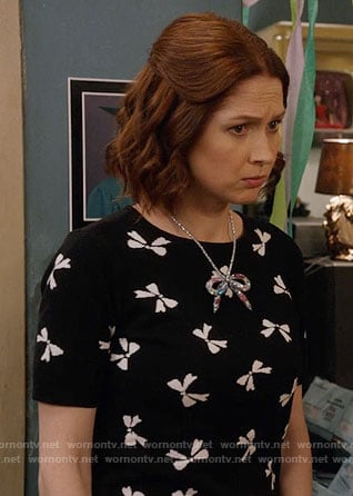 Kimmy’s black bow print top on Unbreakable Kimmy Schmidt