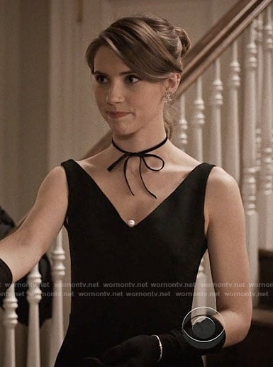 Stevie’s black v-neck dress with pearl on Madam Secretary