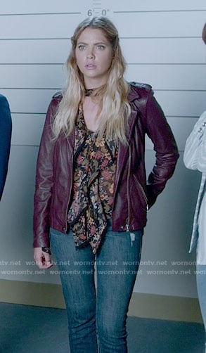 Hanna’s floral ruffled front blouse and purple leather jacket on Pretty Little Liars