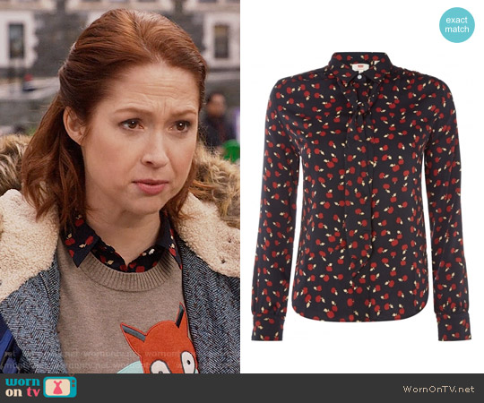 Levis Apple Print Blouse worn by Kimmy Schmidt (Ellie Kemper) on Unbreakable Kimmy Schmidt