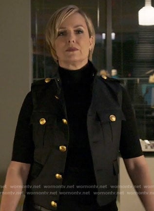 Jacqueline’s black vest with gold buttons on The Bold Type