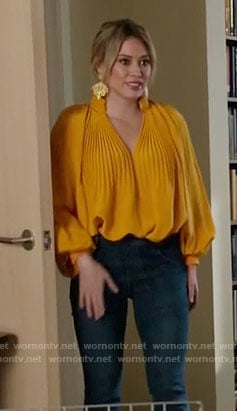 Kelsey’s yellow pleated blouse on Younger