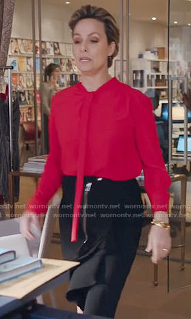 Jacqueline’s red blouse and black ruffled skirt on The Bold Type