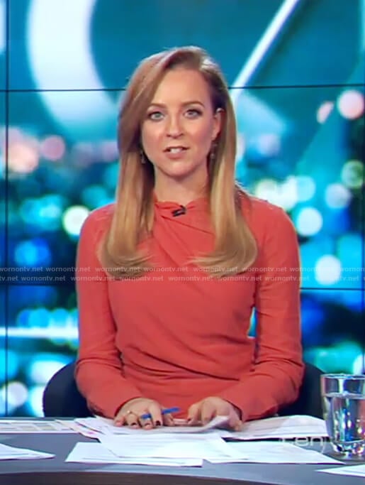 Carrie’s red long sleeved dress on The Project