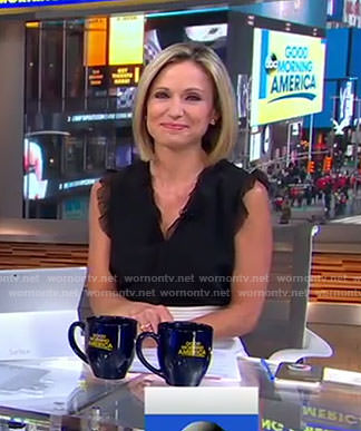 Amy’s black ruffle shoulder top and white skirt on Good Morning America