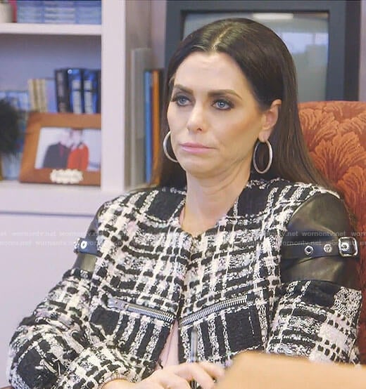 D’Andra’s black and white tweed jacket  with leather and buckles on The Real Housewives of Dallas