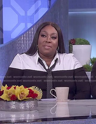 Loni’s black layered blouse and checked pants on The Real