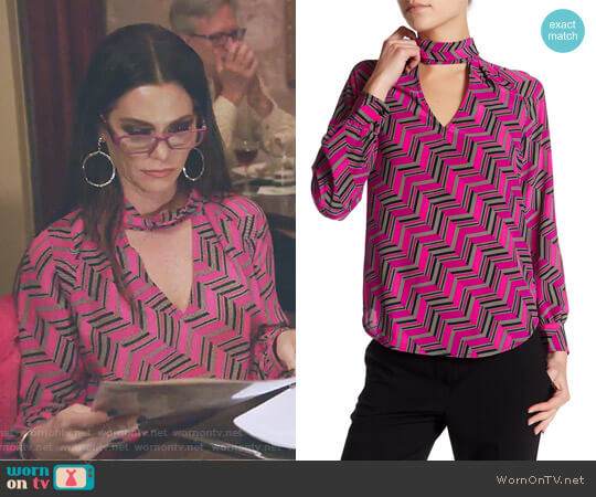 Trina Turk Abundant Mock Neck Silk Blouse worn by D’Andra Simmons on The Real Housewives of Dallas