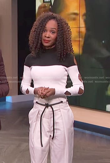 Zuri’s white color-block cutout sleeve top and belted pants on E! News