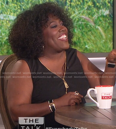 Sheryl’s black sleeveless zip front top on The Talk