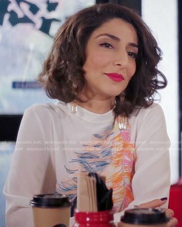 Delia’s white feather print blouse on Girlfriends Guide to Divorce