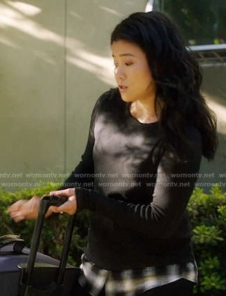 Happy’s black plaid layer sweater on Scorpion