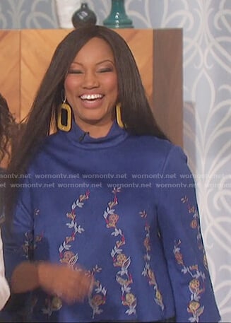 Garcelle Beauvais’s blue embroidered floral top on The Talk