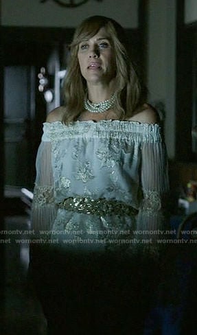Pamela’s white and gold off-shoulder top on Last Man on Earth