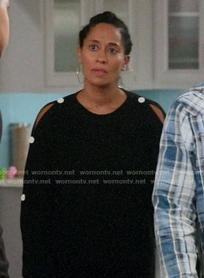 Rainbow’s black sweater with white button sleeves on Black-ish