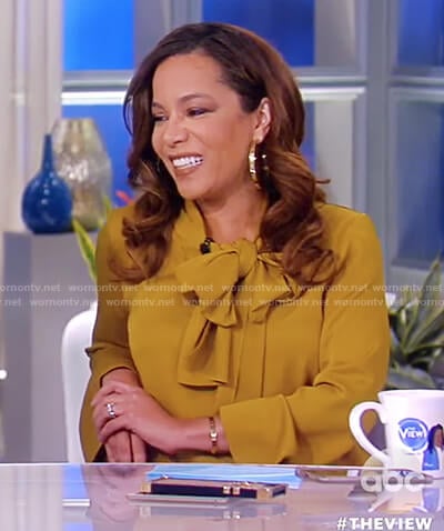 Sunny’s yellow long sleeve pussy-bow top on The View
