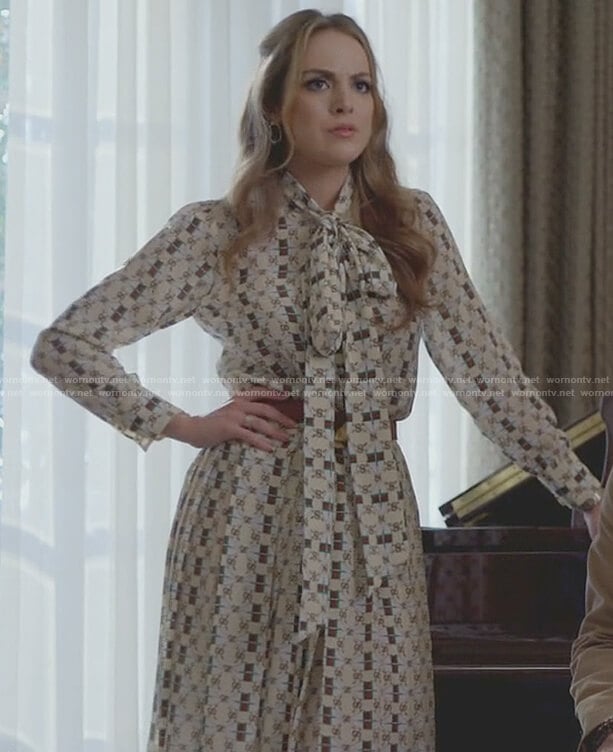 Fallon’s white logo print tie neck dress on Dynasty