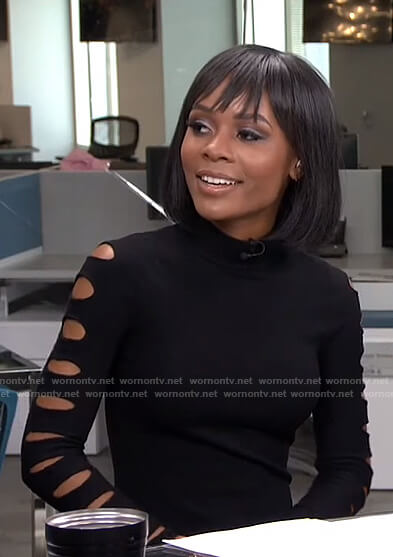 Zuri’s black cutout sleeve top on Live from E!