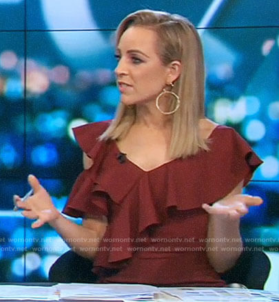 Carrie’s red cold shoulder ruffle dress on The Project