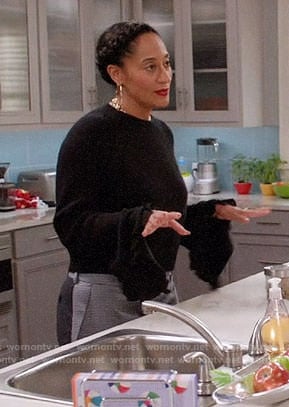 Rainbow’s black ruffle trim sweater and colorblock trousers on Black-ish