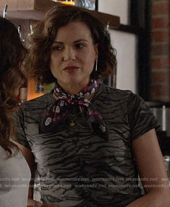 Roni’s tiger stripe print t-shirt and black and pink skull print scarf on Once Upon a Time