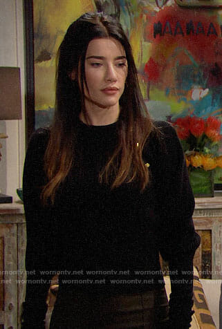 Steffy’s black sweater with gold shoulder buttons on The Bold and the Beautiful