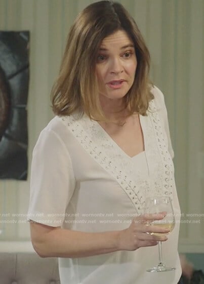 Heather’s white laceup v-neck top on Life in Pieces