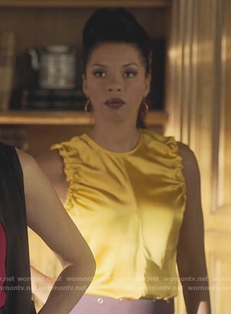 Catherine’s yellow sleeveless top on Marvel’s Runaways