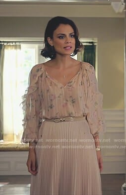 Cristal’s pink floral ruffle sleeve blouse and pleated skirt on Dynasty
