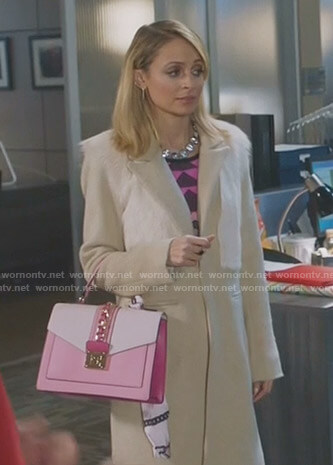 Portia’s beige fur panel coat and pink hand bag on Great News