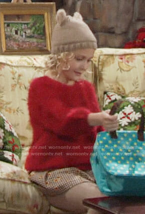 Faith’s red fluffy sweater and checked skirt on The Young and the Restless