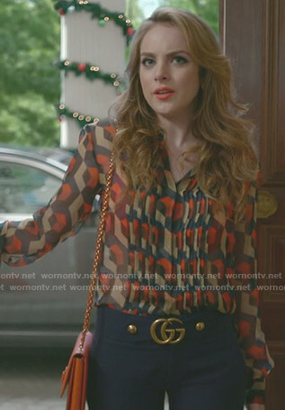 Fallon’s printed blouse and blue cropped pants on Dynasty