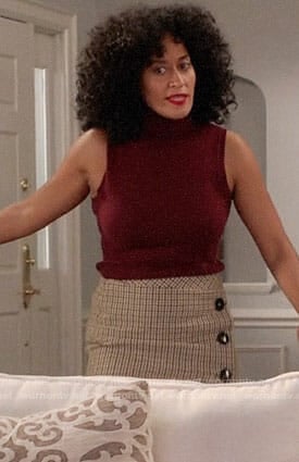 Rainbow’s red sleeveless turtleneck top and checked button up skirt on Black-ish
