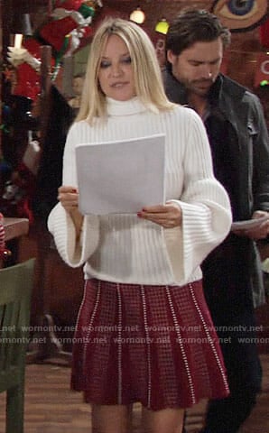 Sharon’s white bell-sleeve sweater and red dotted skirt on The Young and the Restless