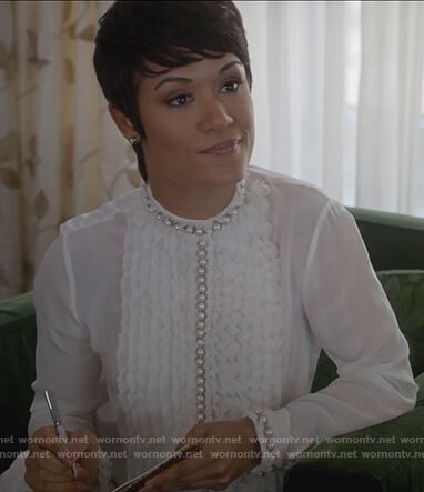 Anika’s white ruffle pearl blouse on Empire