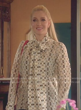 Erika’s logo print tie neck blouse on The Real Housewives of Beverly Hills