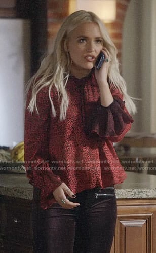 Maddie’s red ruffled blouse with tie neck on Nashville