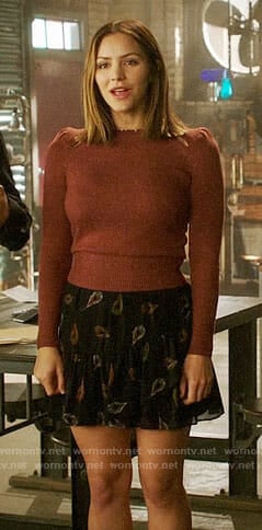 Paige’s puff-shoulder sweater and feather print skirt on Scorpion