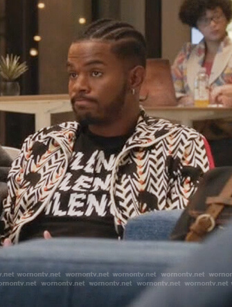 Aaron’s elephant print sweater and black t-shirt on Grown-ish