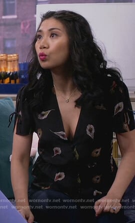 Eve’s black feather print top on 9JKL